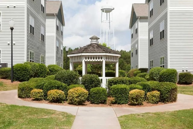 Buildings gazebo and manicured bushes exterior at University Village At Clemson in Central Student Accommodation