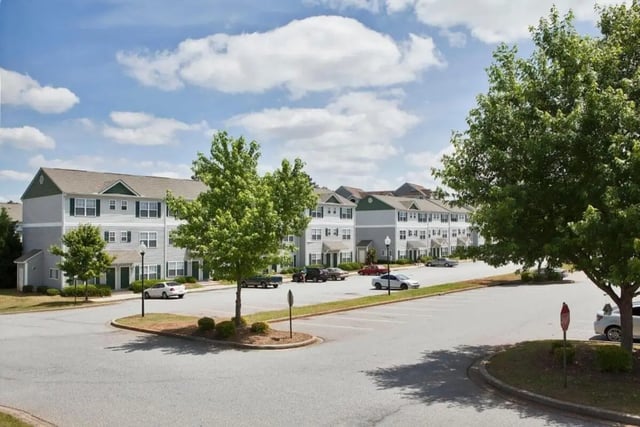 Apartment buildings and cars exterior at University Village At Clemson in Central Student Accommodation