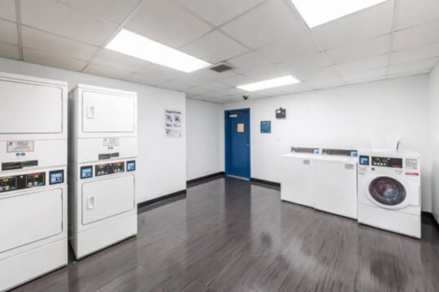 Laundry machines and basket communal laundry area at University Village Towers in Riverside Student Accommodation