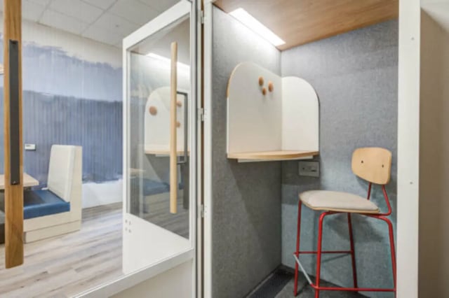 Small white booth with chair and table study area at University Village Towers in Riverside Student Accommodation