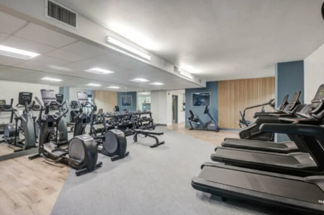 Treadmills ellipticals and weight rack fitness room at University Village Towers in Riverside Student Accommodation