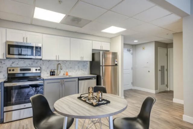 Stove refrigerator sink dining table kitchen area at University Village Towers in Riverside Student Accommodation