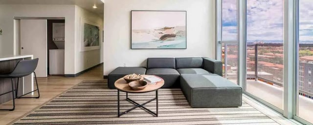 Modern living room with sectional sofa and view. at Vesper Holdings