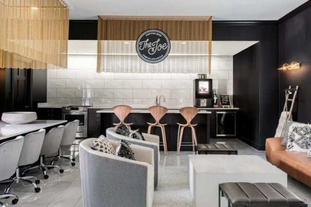Bar stools counter coffee machine sofas lounge area at Vesper Holdings