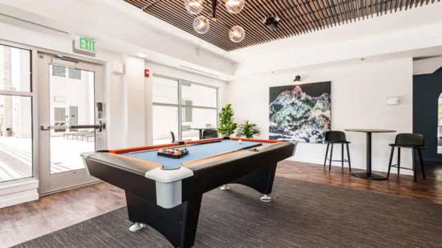 Pool table painting and stools lounge area at The Vista Apartments in Boise Student Accommodation