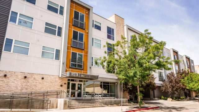 Modern building entrance with stairs and ramp exterior at The Vista Apartments in Boise Student Accommodation