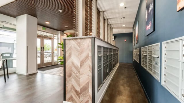 Mailboxes and hallway with artwork and entrance interior at The Vista Apartments in Boise Student Accommodation
