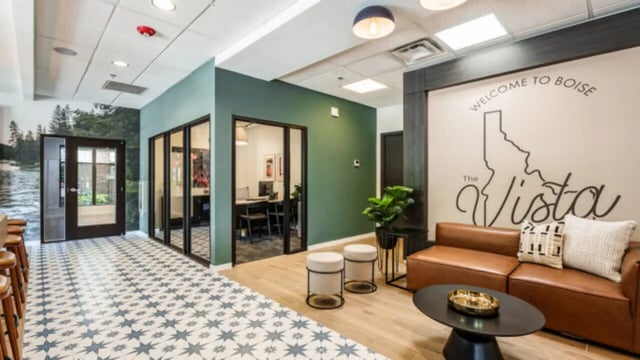 Leather couch and coffee table common area at The Vista Apartments in Boise Student Accommodation