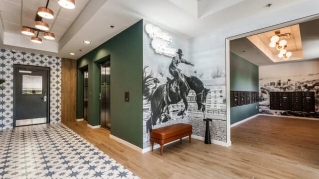 Elevator lobby with art bench mailboxes building lobby at The Vista Apartments in Boise Student Accommodation