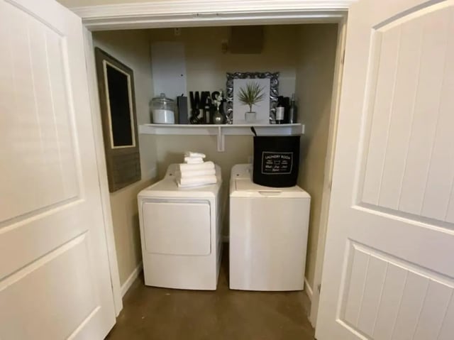 Washer dryer with laundry basket and decorations laundry area at The Collective At Auburn in Auburn Student Accommodation