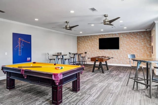 Pool table foosball table lounge room at The Collective At Auburn in Auburn Student Accommodation