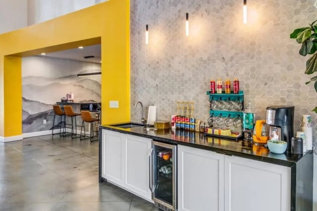 Coffee station with sink mini fridge and bar area at The Collective At Auburn in Auburn Student Accommodation