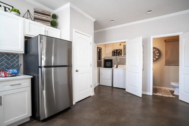 Refrigerator washer dryer toilet kitchen laundry bathroom at The Collective At Auburn in Auburn Student Accommodation