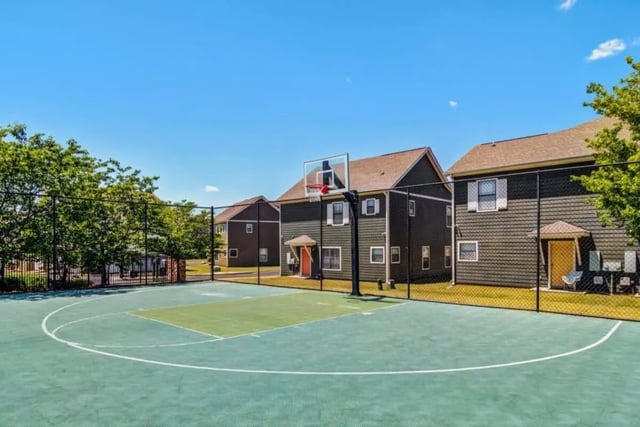Basketball court with buildings exterior at The Collective At Auburn in Auburn Student Accommodation