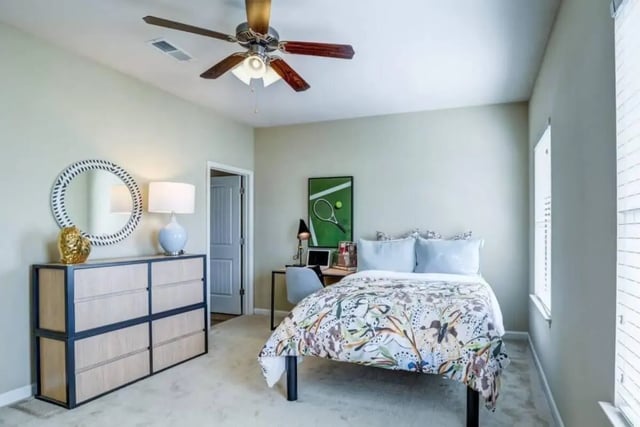 Bed dresser desk lamp ceiling fan bedroom at The Collective At Clemson in Clemson Student Accommodation