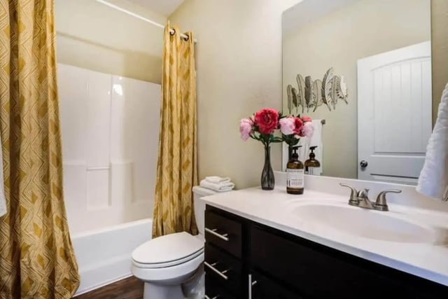 Toilet shower and vanity with flowers bathroom at The Collective At Clemson in Clemson Student Accommodation