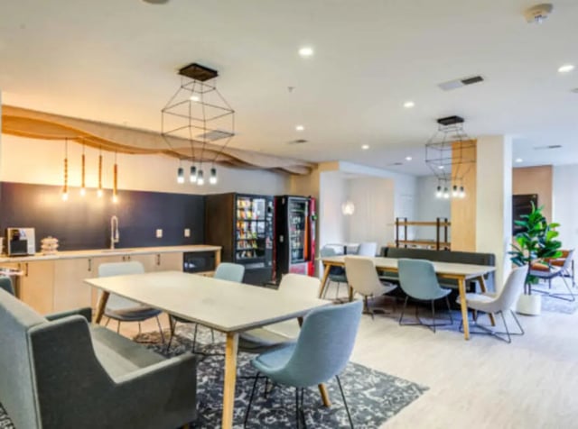 Kitchen area with tables vending machines and seating common area at Wertland Square in Charlottesville Student Accommodation