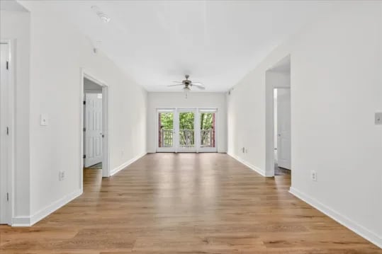 Empty white room with doors and balcony living room at Wertland Square in Charlottesville Student Accommodation