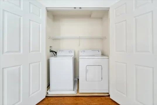 White washer dryer and shelf Laundry Room at Wertland Square in Charlottesville Student Accommodation
