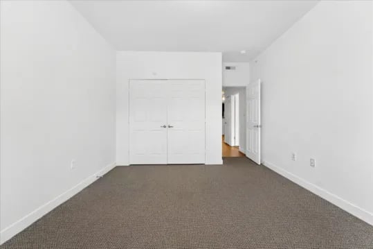 White closet doors leading to hallway bedroom at Wertland Square in Charlottesville Student Accommodation