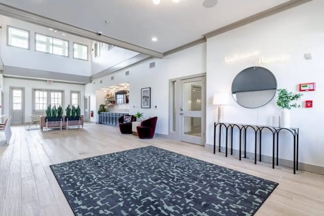 Large lobby with rug bar and seating area at The Collective At Norman in Norman Student Accommodation
