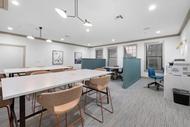 Study tables chairs partitions and windows study area at The Collective At Norman in Norman Student Accommodation