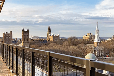 Railed balcony overlooking historic buildings cityscape exterior at The Archive in New Haven Student Accommodation