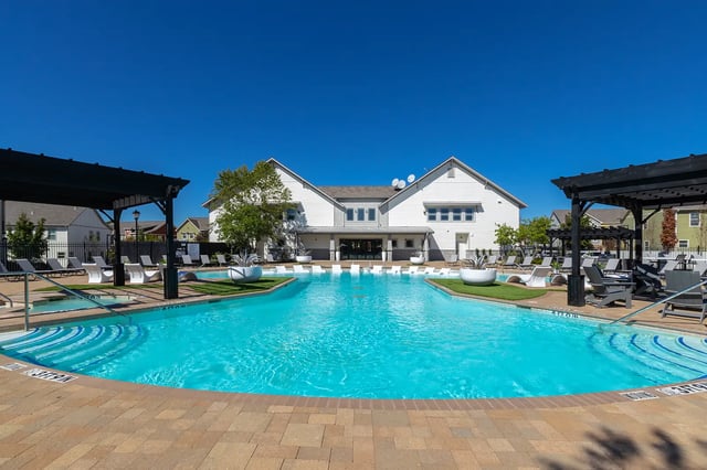 Large swimming pool with lounge chairs exterior at The Collective at Columbia in Columbia Student Accommodation