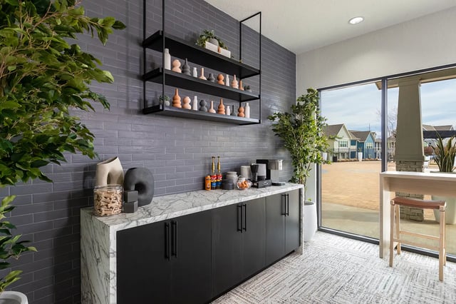 Coffee bar with black cabinets marble counter plants kitchen at The Collective at Columbia in Columbia Student Accommodation