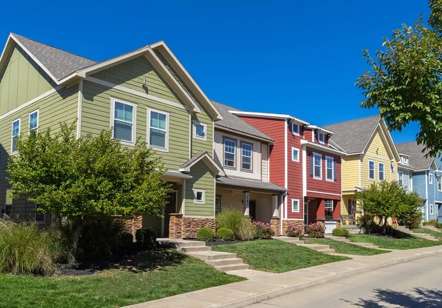 Colorful townhouses with stairs and green lawns exterior at The Collective at Columbia in Columbia Student Accommodation