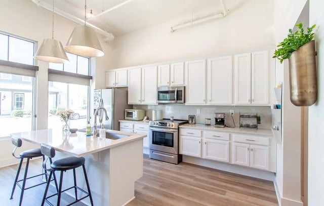 Modern kitchen with island stove refrigerator kitchen at Midtown Auburn in Auburn Student Accommodation