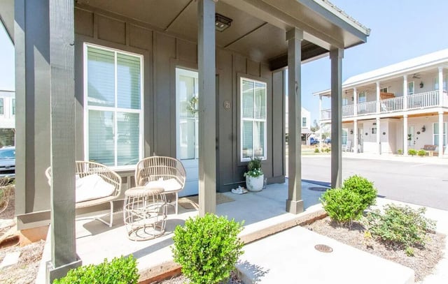 Two wicker chairs and table exterior at Midtown Auburn in Auburn Student Accommodation