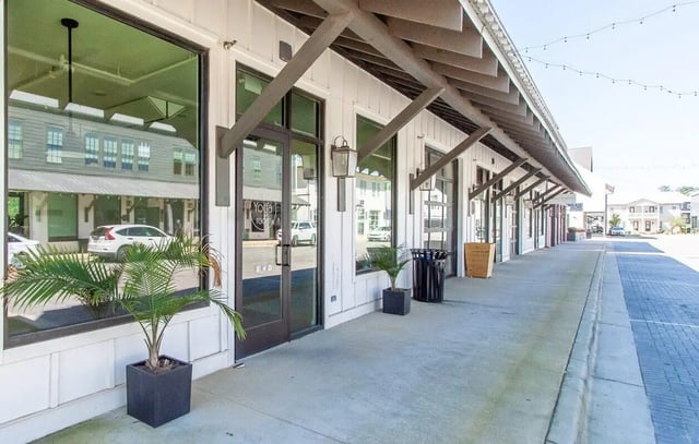 Modern building with plants and windows exterior at Midtown Auburn in Auburn Student Accommodation