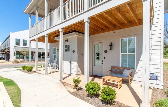 Wooden bench and table outdoor living space exterior at Midtown Auburn in Auburn Student Accommodation