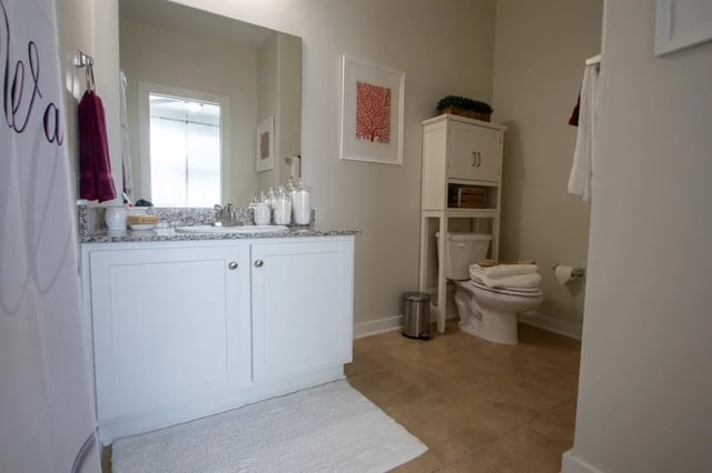 White vanity toilet and towel storage bathroom at The Waverly in Newark Student Accommodation