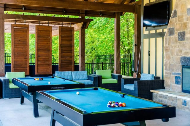 Pool tables sofas chairs and fireplace recreation area at The Waverly in Newark Student Accommodation