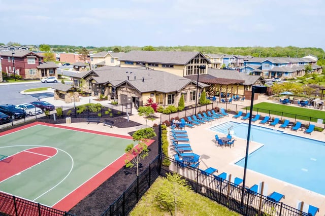 Basketball court pool lounge chairs buildings exterior at The Waverly in Newark Student Accommodation