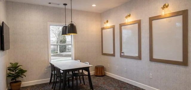 Whiteboards and table with chairs study area at The Connection at Lawrence in Lawrence Student Accommodation