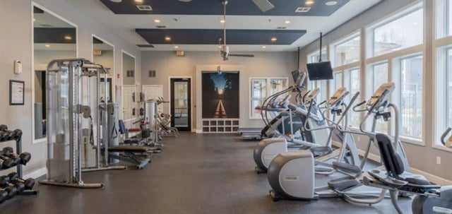 Weight rack elliptical machines and mirrors gym area at The Connection at Lawrence in Lawrence Student Accommodation