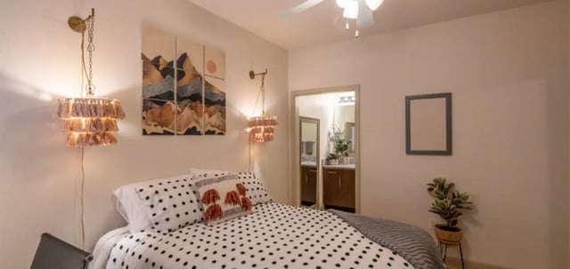 Tassel lamps artwork polka dot bedding bathroom visible bedroom at The Connection at Lawrence in Lawrence Student Accommodation