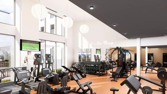 Treadmills weight machines and dumbbells fitness room at Proxi Lawrence Apartments in Lawrence Student Accommodation