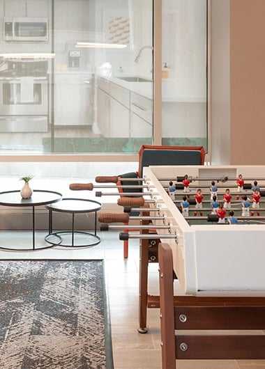 Foosball table with players two side tables playing area at SoCam 290 Apartments in New Brunswick Student Accommodation