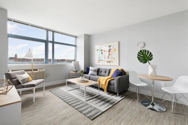 Sofa coffee table rug chairs living room at SoCam 290 Apartments in New Brunswick Student Accommodation