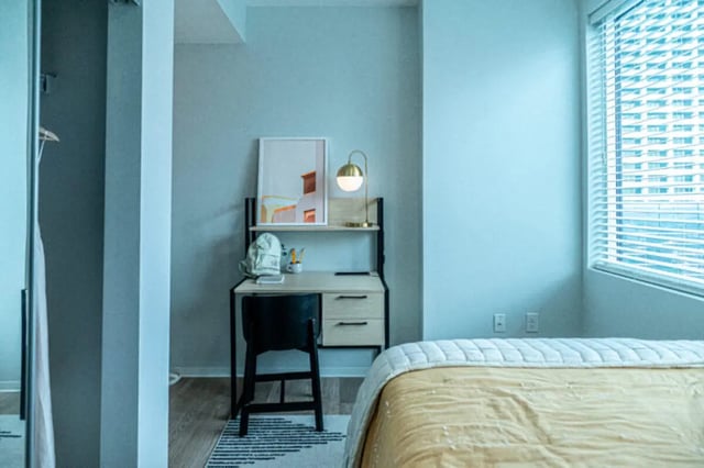 Desk chair artwork lamp rug bedroom study area at The Connector Apartments in Atlanta Student Accommodation