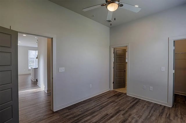 Ceiling fan wood floors visible doors bedroom at The Highlands in Reno Student Accommodation