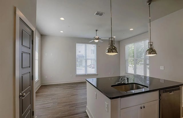 Countertop sink dishwasher and pendant lights kitchen at The Highlands in Reno Student Accommodation