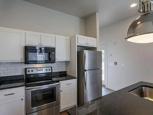 Stainless steel refrigerator stove microwave kitchen at The Highlands in Reno Student Accommodation