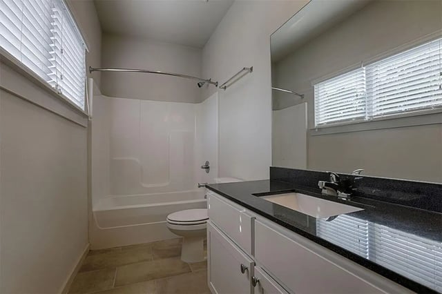 Toilet bathtub vanity with sink bathroom at The Highlands in Reno Student Accommodation