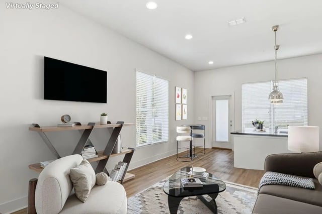 Sofa coffee table TV bar stools living room kitchen at The Highlands in Reno Student Accommodation
