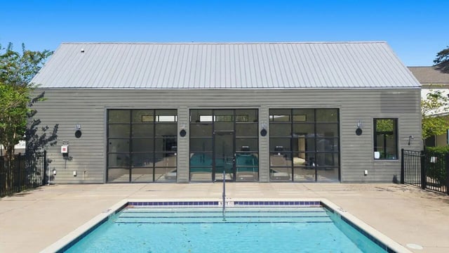 Swimming pool with adjacent building exterior at The Highlands in Reno Student Accommodation